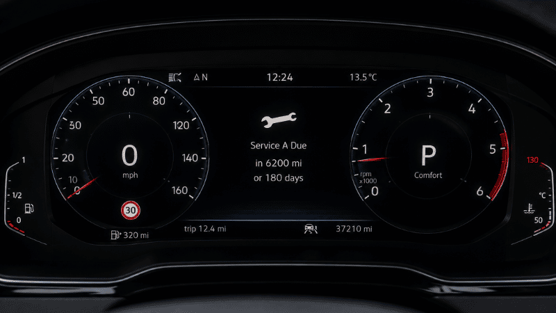 A car dashboard showing a brand-specific service reminder indicator with Service A or Service B designation, representing European vehicle scheduled maintenance notification