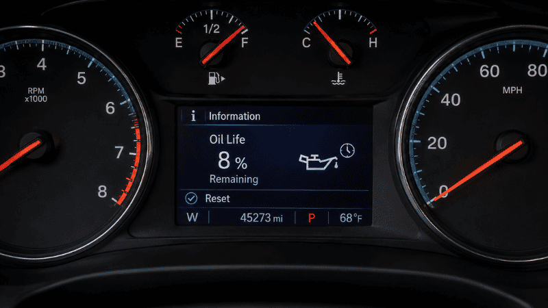 A car dashboard display showing the oil life monitor reading 8 percent remaining, indicating the service engine soon maintenance reminder is about to activate