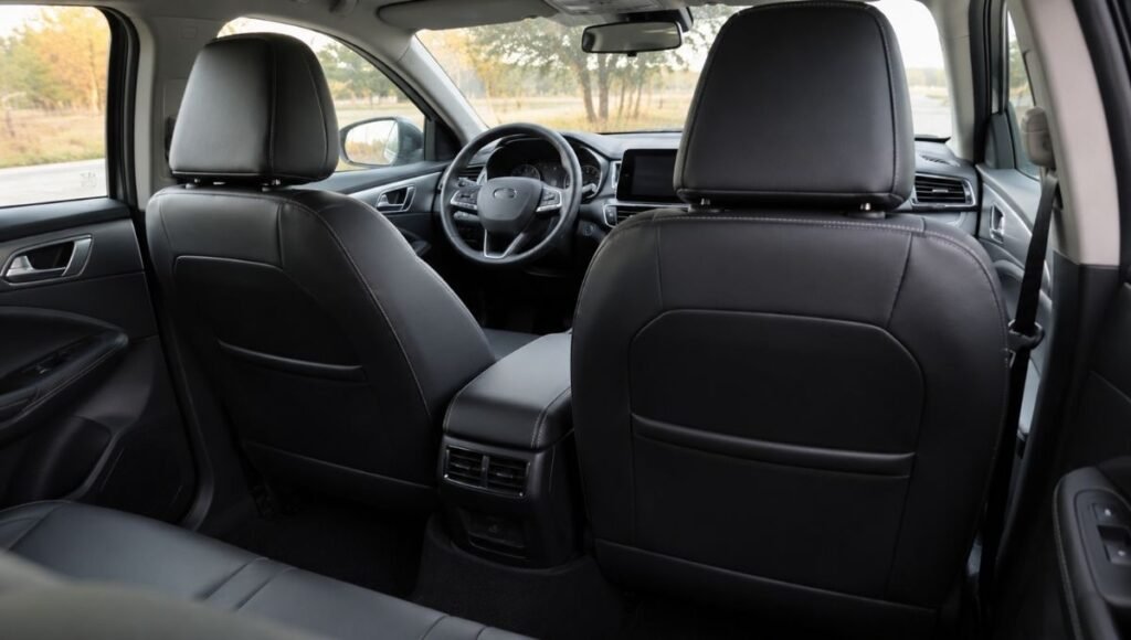 A pair of custom-fit leatherette car seat covers installed perfectly on front car seats showing smooth fit with no bunching or gaps